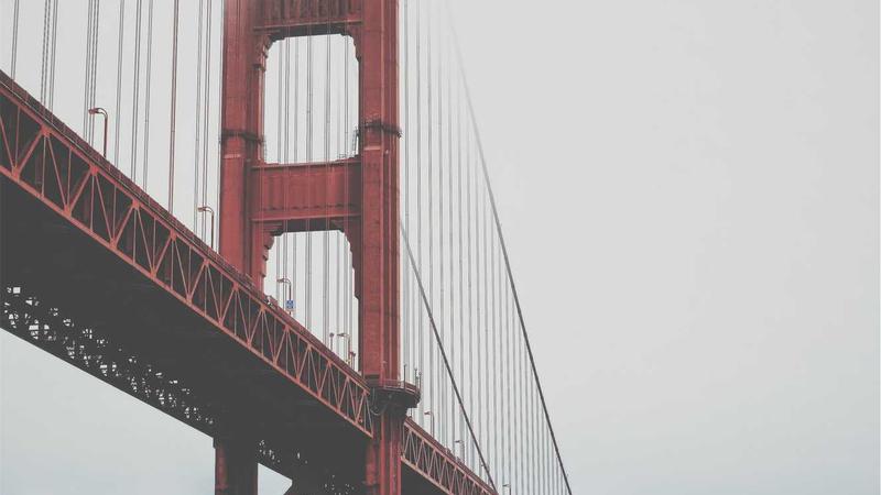 Top 5 Low-Interest Credit Cards for Debt Consolidation 2026 1 Person reviewing credit card statements at a desk