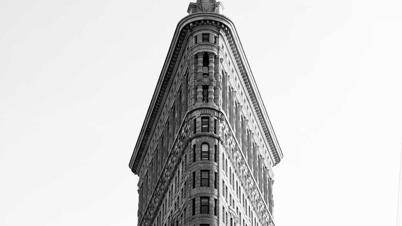 Credit Card Guides 3 Several credit cards spread out on a table with a person analyzing them