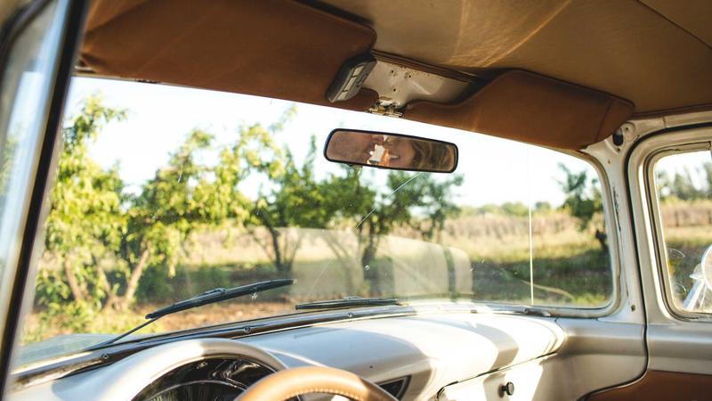 Person calculating finances with a credit card and laptop